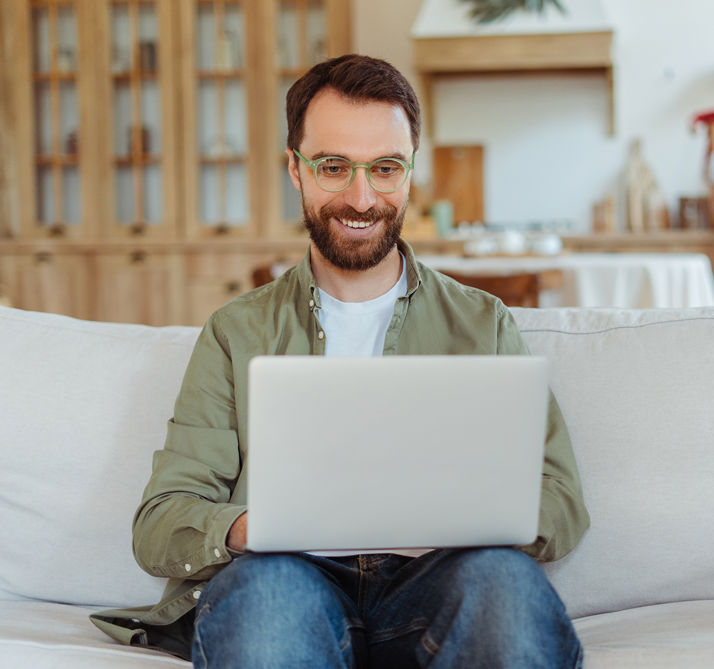 Portrait of smiling parent using laptop computer fi